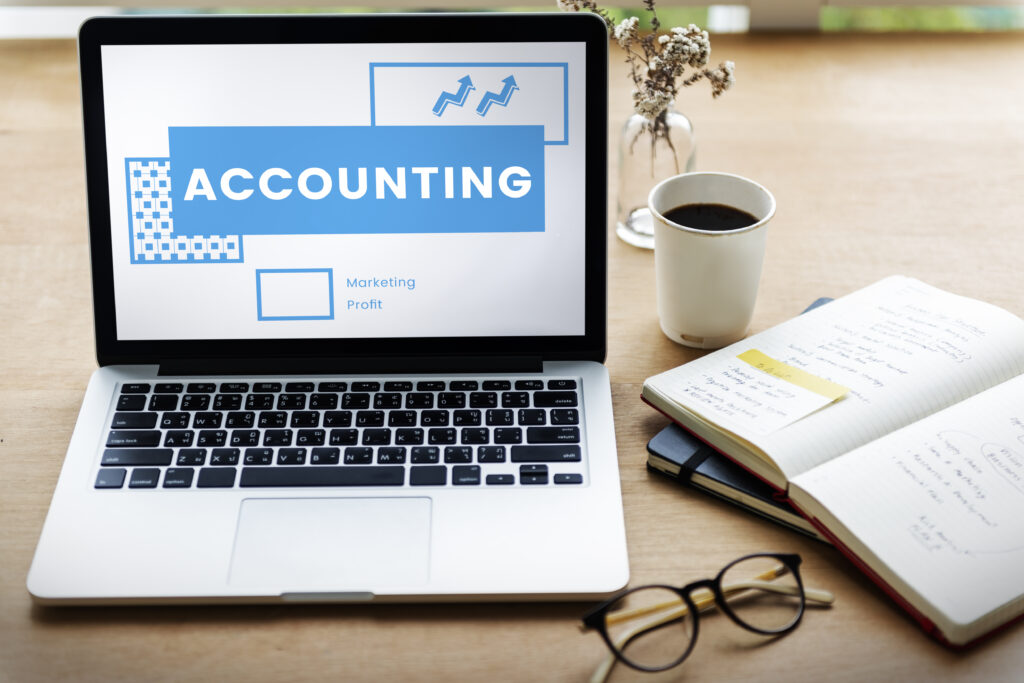 Top Benefits of Outsourcing Accounting Services for Small Businesses in the UK 2 Network connection graphic overlay on laptop